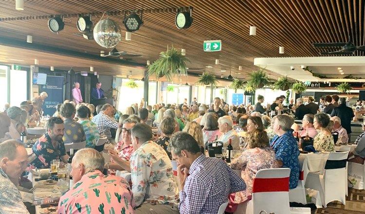 A large group of people dining at the fundraiser lunch
