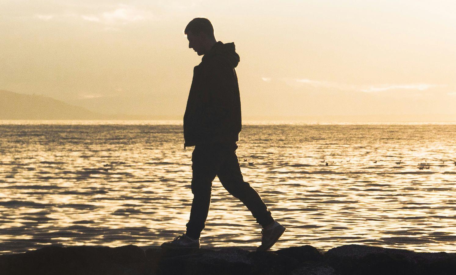 Man walking on beach
